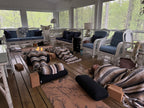 Relaxing yoga retreat on a screened-in deck. 