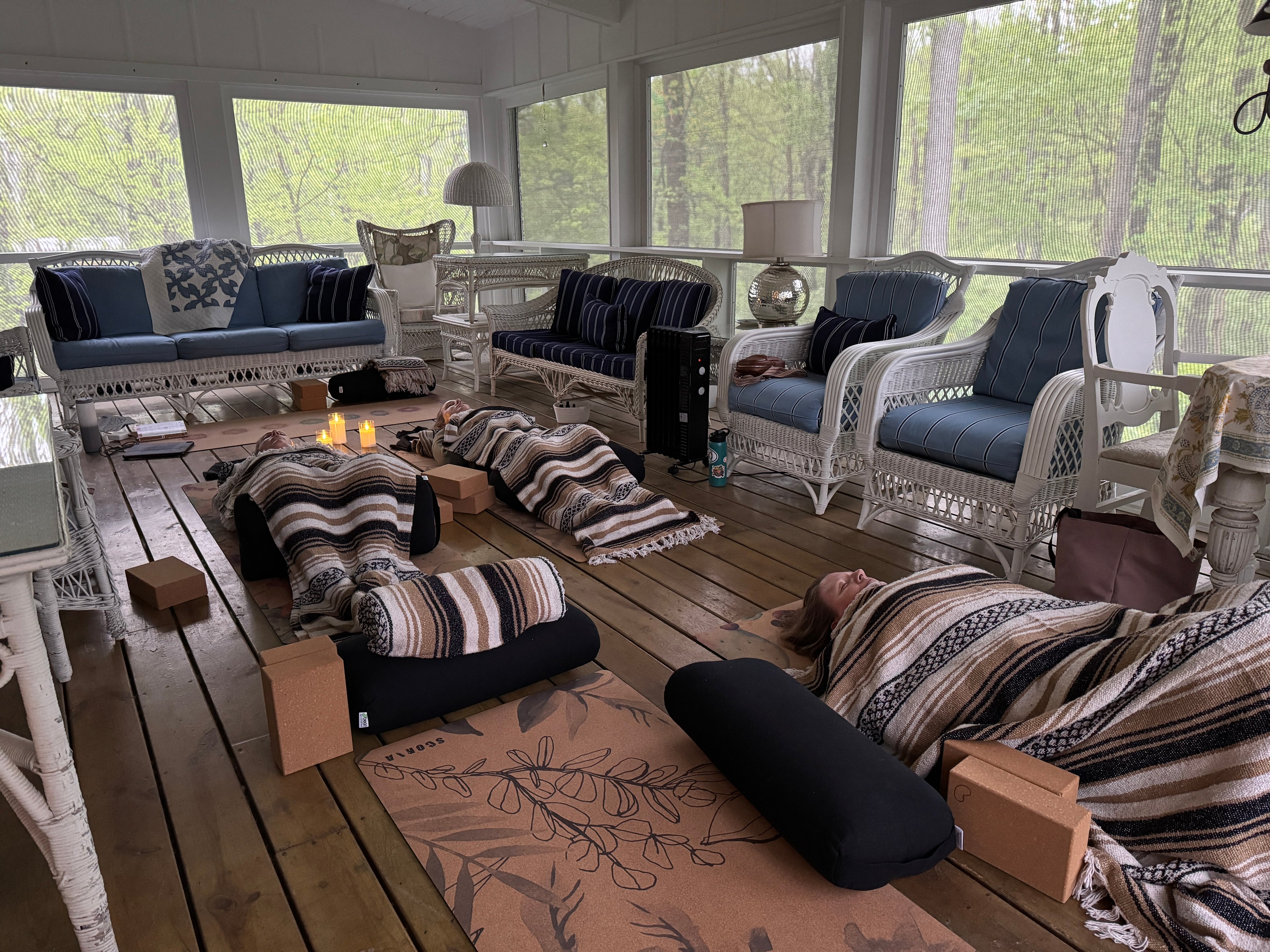 Relaxing yoga retreat on a screened-in deck. 