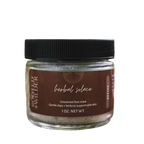 Jar of herbal face mask with a black lid on a white background